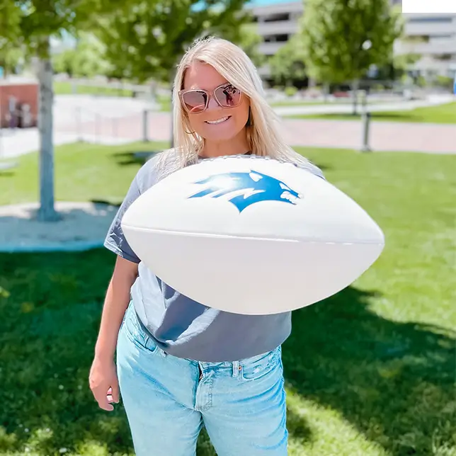 young woman holding a football